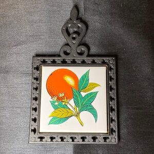 1960’s Cast Iron and Ceramic Trivet